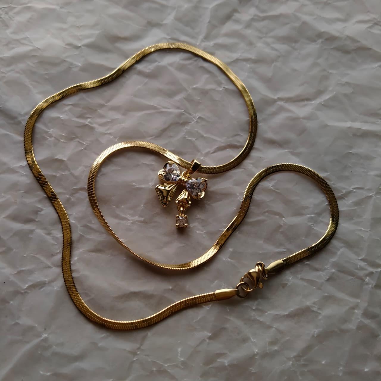 Aurielle Crystal Bow Pendant Necklace – Gold Plated Snake Chain
